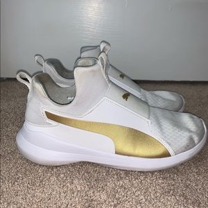 white and gold puma foam sneakers